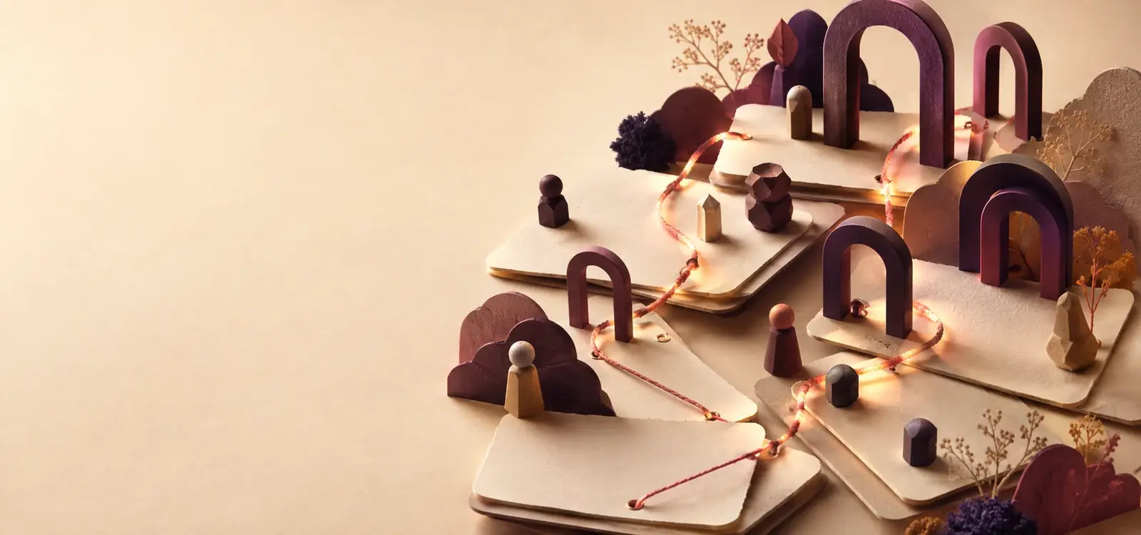 Blank story cards laid out across a landscape of arches and small figures, joined by a single glowing thread